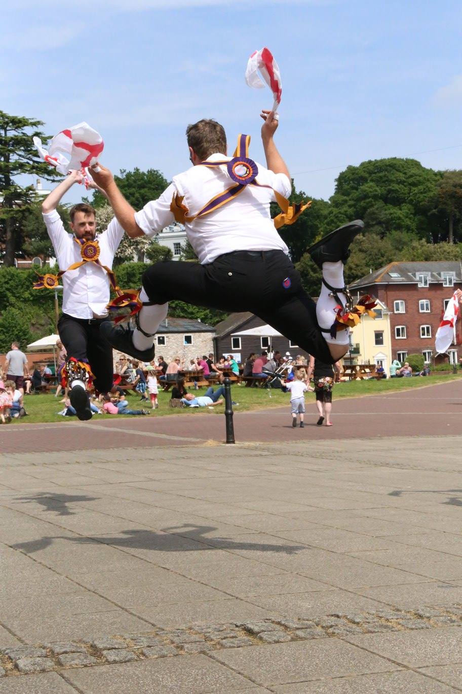 Two dancers jumping high